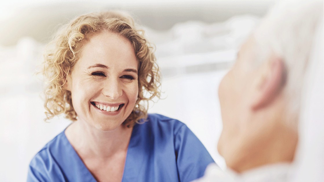 smiling female nurse with patient